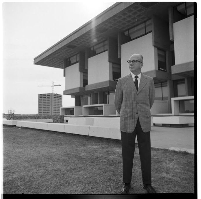 James A. Michener posing at one of only two buildings in the world permitted to use his name
